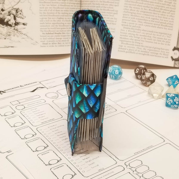 Blue Dragonscale spellbook Edge view showing cards and closure.