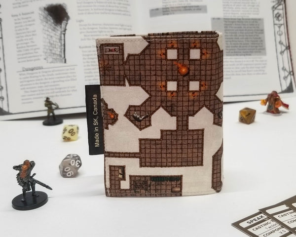 Spellbook made from fabric with a dungeon map on a light background, back view