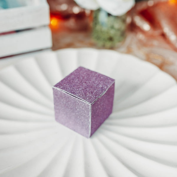 purple d6 favor box on a place setting