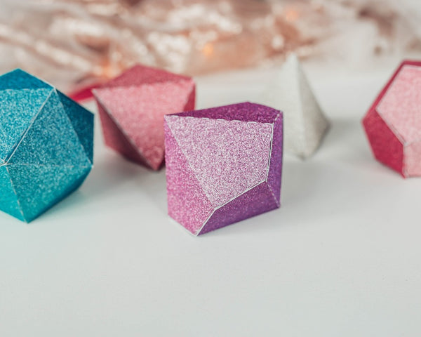 closeup of a lavender d10 paper dice box