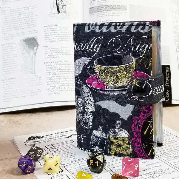 tarot-sized spellbook in a metallic silver halloween print. Front view showing closure and product label.