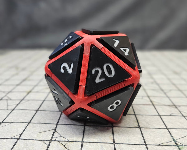 D20 fidget clicker with a Red frame, black faces and white numbers. 