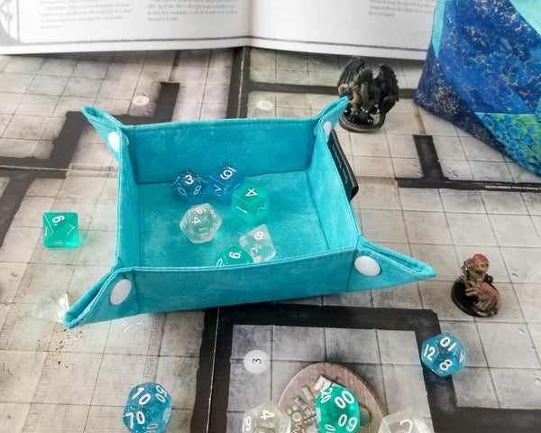 Light Blue tray shown with dice for scale
