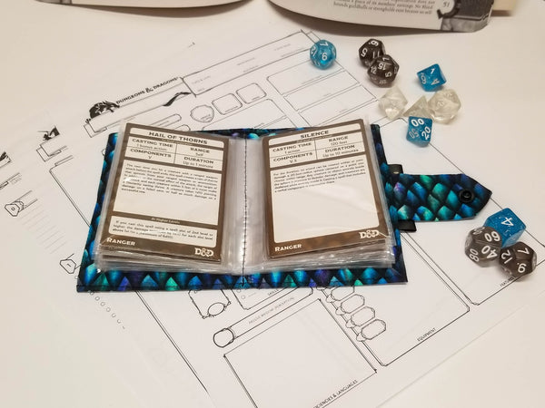 Blue dragonscale spellbook Open showing spell cards