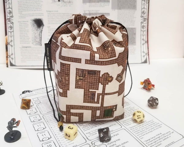 brown and cream dungeon map print dice bag. back view
