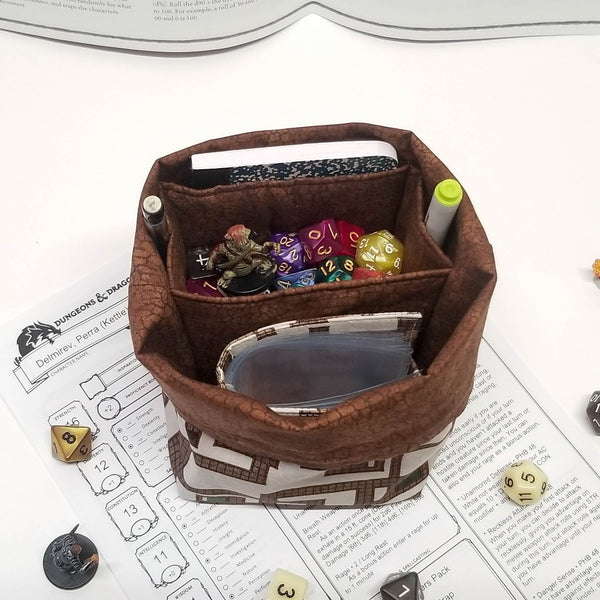 Dungeon map dice bag folded open to show brown crackle lining with storage pockets