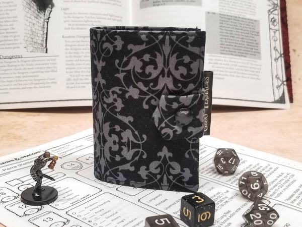 Black and grey damask print Spellbook. Front view of closure. 