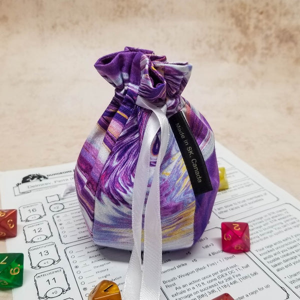 small fancy purple dice bag with white ribbon closture