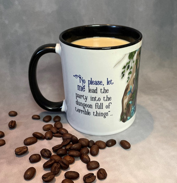 White cleric mug with black handle and black interior. Mug Reads: "No please, let ME lead the party into the dungeon full of terrible things..." Shown containing coffee