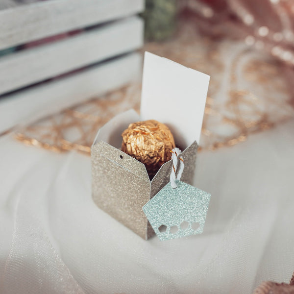 Champagne glitter d6 favor box, with pale mint tag. 