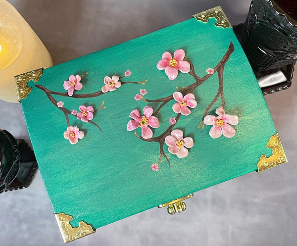 Cherry blossom chest in a shimmery mint green with 3D cherry blossoms and brass hardware.  Top View