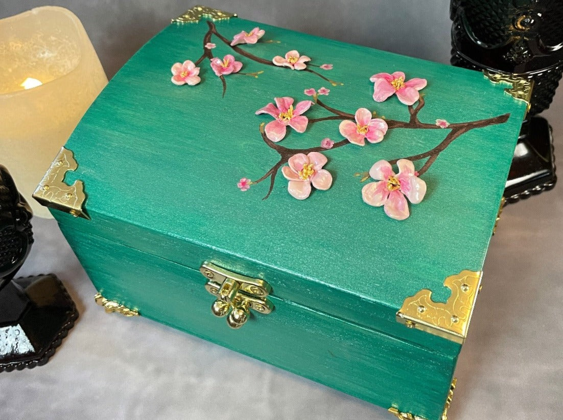 Cherry blossom chest in a shimmery mint green with 3D cherry blossoms and brass hardware. Top View Closed. 