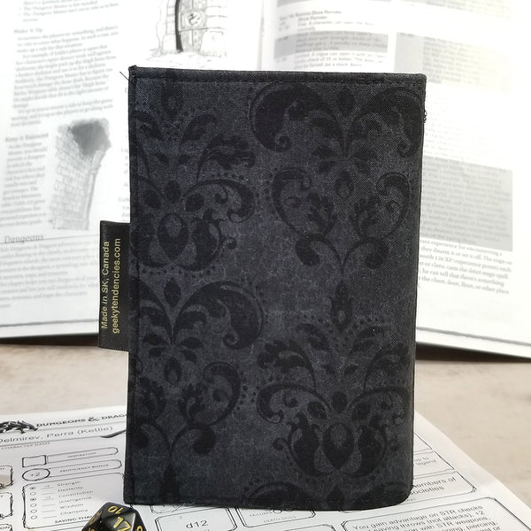 Tarot-sized spellbook in black damask back view. 
